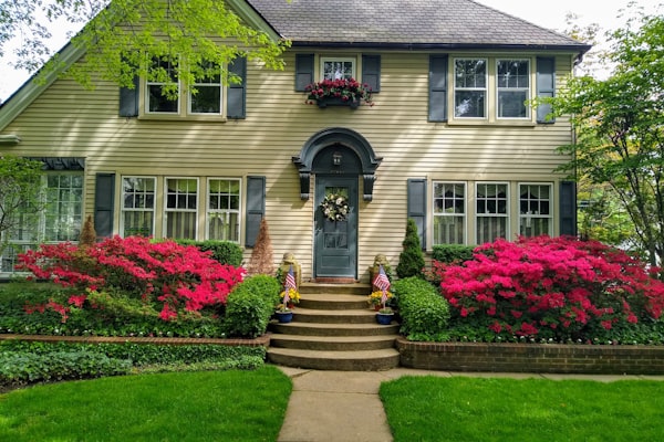 Beautiful home exterior with fresh paint and flowers
